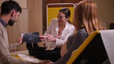 Happy future parents looking at ultrasound picture