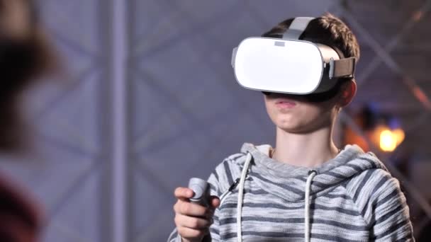 Happy teenage boy after game in VR goggles — Stock Video