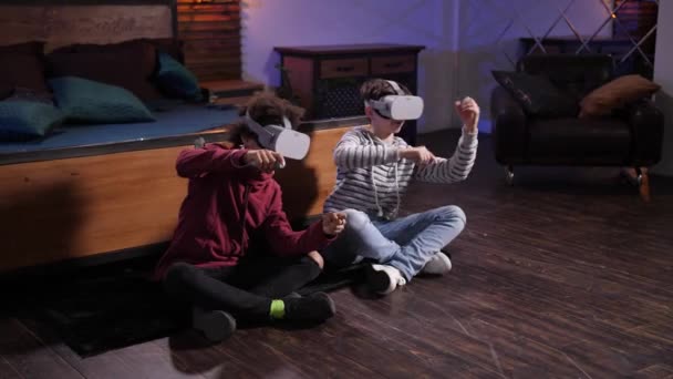 Cute mixed race friends racing cars in VR goggles — Stock Video