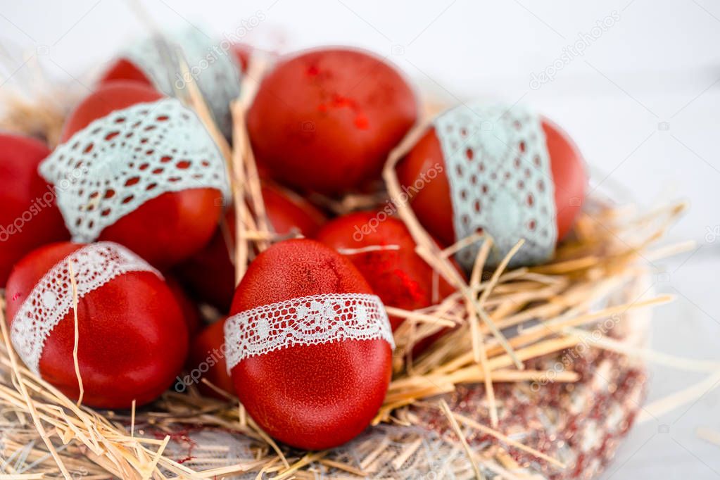 Red Easter eggs in a nest of hay