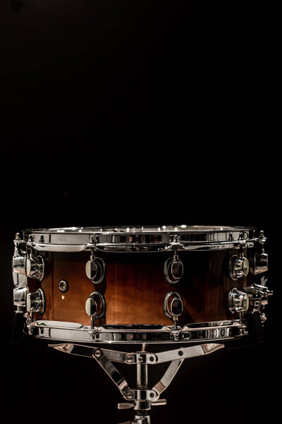 Snare on a black background, musical instrument, musical concept