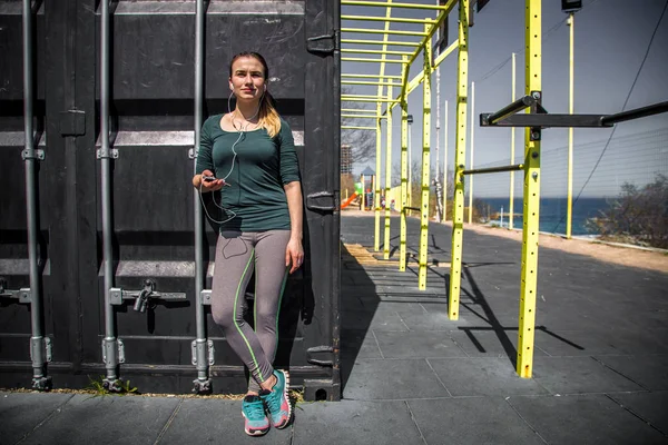 woman in sports clothes on the Playground