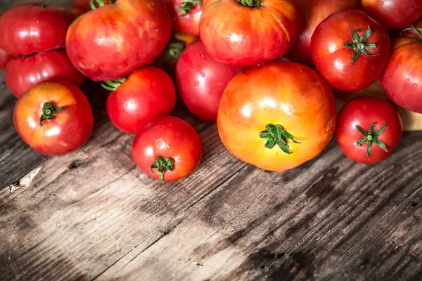 Ripe Tomatoes on wooden background — Stock Photo, Image
