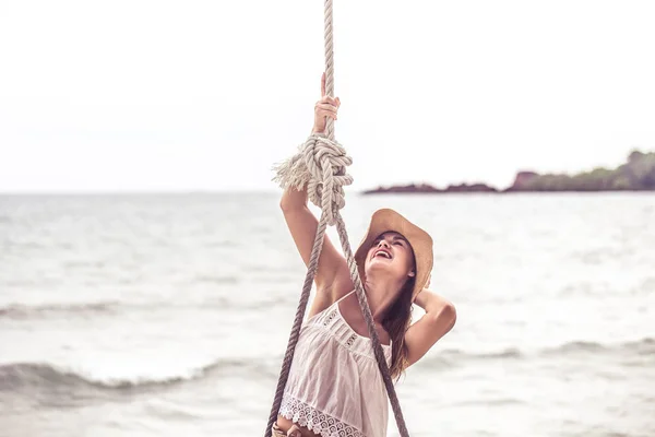 Girl stands on a swing on the beach of Thailand — Stock Photo, Image