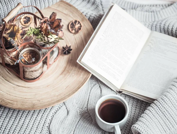 Book with a cup of coffee on the bed in the home interior Stock Picture