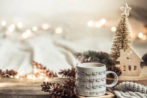 Festive background with Cup on wooden background with lights. — Stock Photo, Image