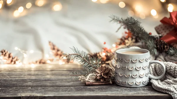 Festive background with Cup on wooden background with lights. — Stock Photo, Image
