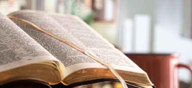 Book Bible close-up, on a beautiful terrace background. Morning 