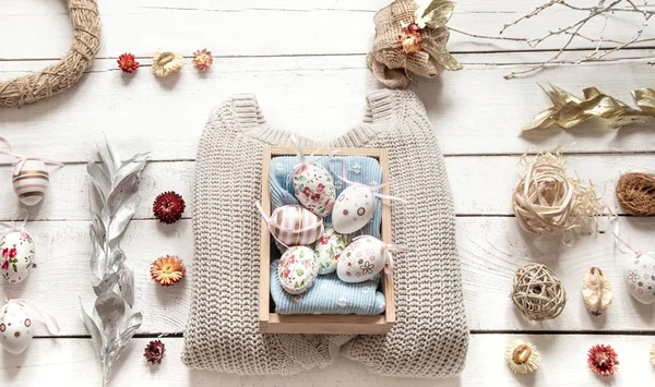 Easter stylish still life on a wooden background.