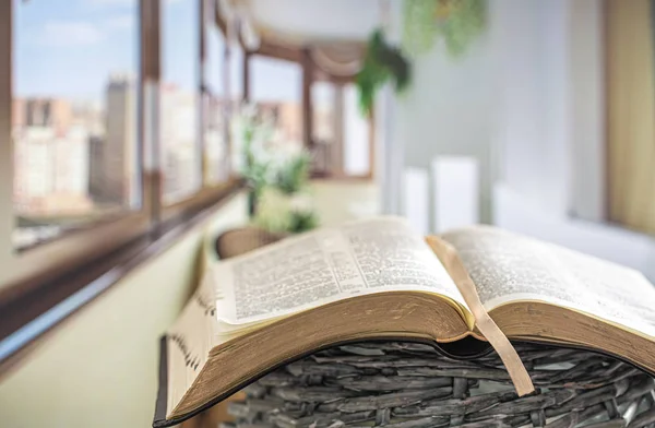 Book Bible close-up, on a beautiful terrace background. Morning — Stok fotoğraf