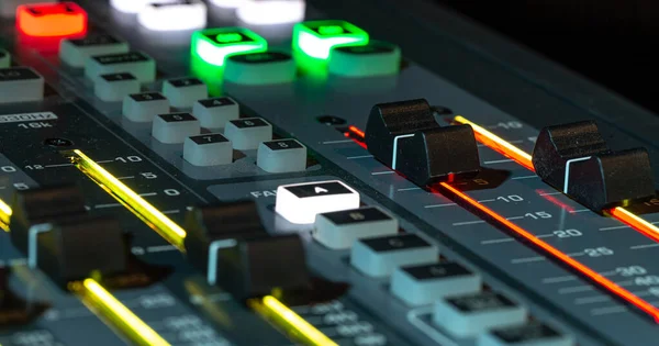 Digital mixer in a recording Studio, close -up. The concept of creativity and show business. Space for text.