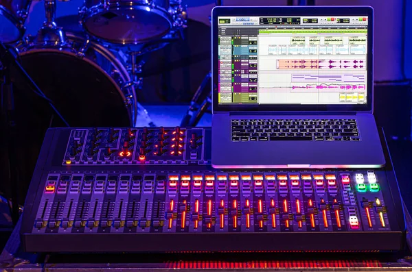 Digital mixer in a recording Studio , with a computer for recording sounds and music. The concept of creativity and show business. Space for text.