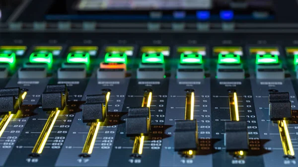 Digital mixer in a recording Studio, close -up. The concept of creativity and show business. Space for text.