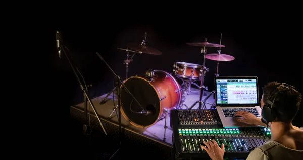 Digital mixer in a recording Studio , with a computer for recording music. On the background of the sound engineer at work. The concept of creativity and show business.