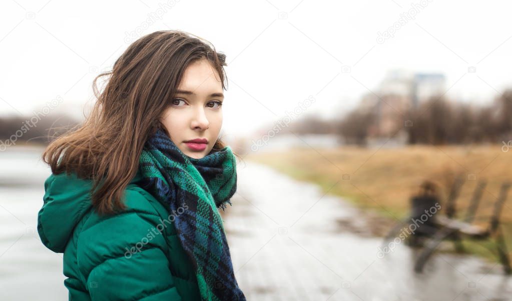 Brunette girl in green scarf 