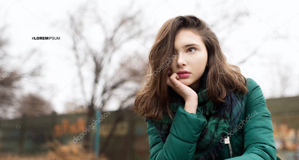 Teen girl in green jacket