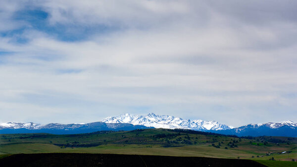 Ice covered mountains under sky