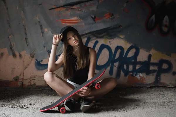 young woman with skateboard