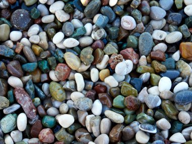 Colored pebbles at the beach clipart