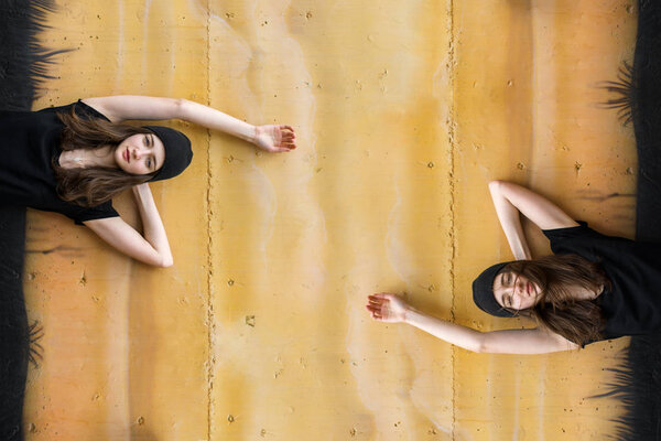 Portrait of beautiful teenage girl in black shirt and hat posing 