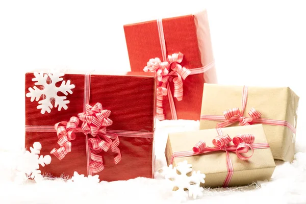 Group of holiday gift boxes decorated with ribbon and snowflakes — Stock Photo, Image