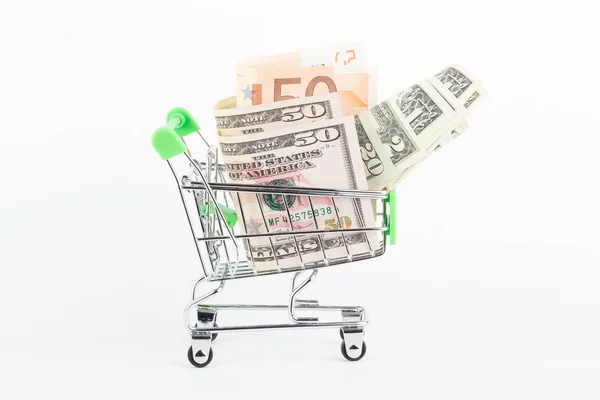 Dólares americanos y cincuenta euros en el carrito de compras, aislado — Foto de Stock