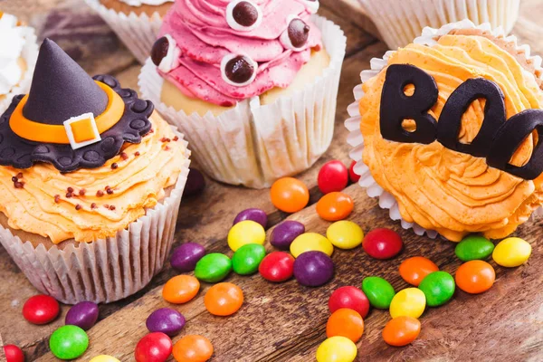 Halloween cupcakes with colored decorations Royalty Free Stock Photos