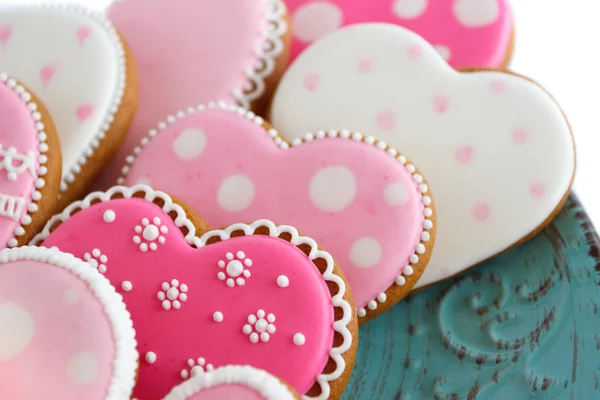 Conjunto de biscoitos em forma de coração rosa com padrões, produtos artesanais — Fotografia de Stock