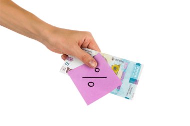 Elinde farklı finansal işaretler ve semboller olan bin tane hrivniya ve çıkartma.