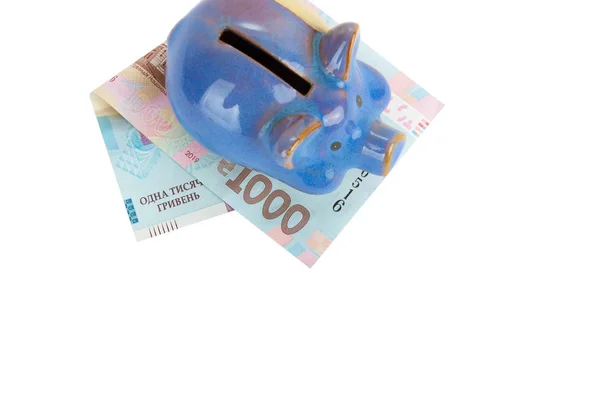 One thousand hryvnias and a piggy bank, isolated — Stock Photo, Image