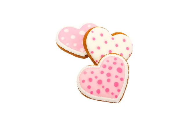 Fondo de galletas rosadas en forma de corazón con diferentes patrones, aislado — Foto de Stock