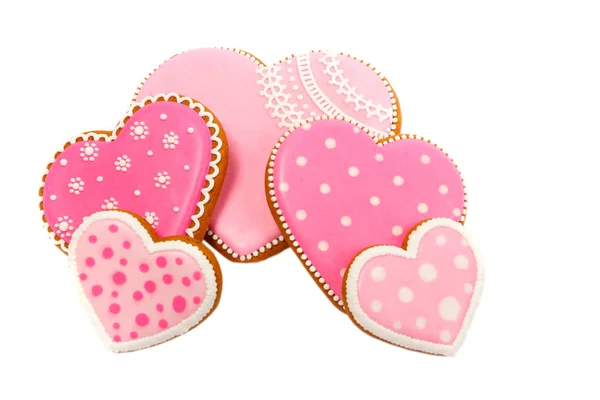Antecedentes de cookies cor-de-rosa em forma de coração com diferentes padrões, isolado — Fotografia de Stock