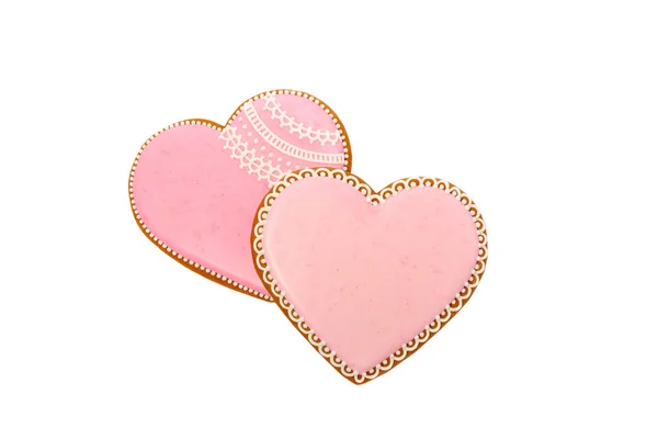 Fond de biscuits roses en forme de coeur avec des motifs différents, isolé sur le blanc — Photo