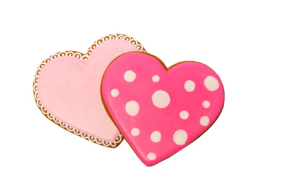 Fond de biscuits roses en forme de coeur avec des motifs différents, isolé sur le blanc — Photo