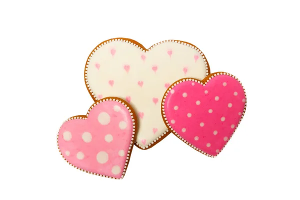 Pozadí z růžové sušenky srdce tvaru s různými vzory, izolované na bílém — Stock fotografie