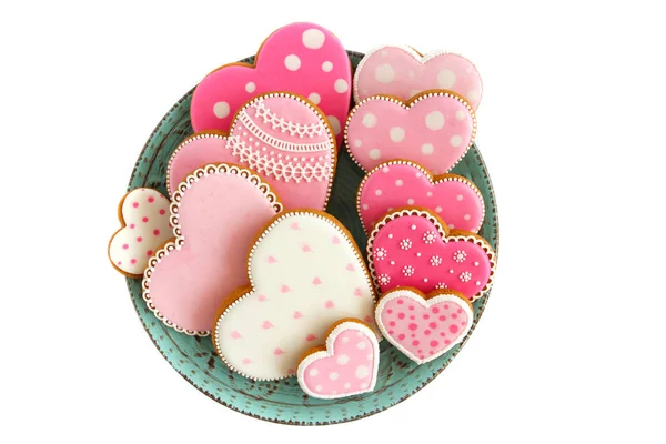 Ensemble de biscuits roses en forme de coeur avec motifs, fond clair — Photo