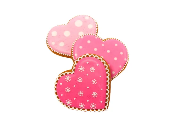 Background from pink cookies heart shaped with different patterns, isolated on white — 스톡 사진