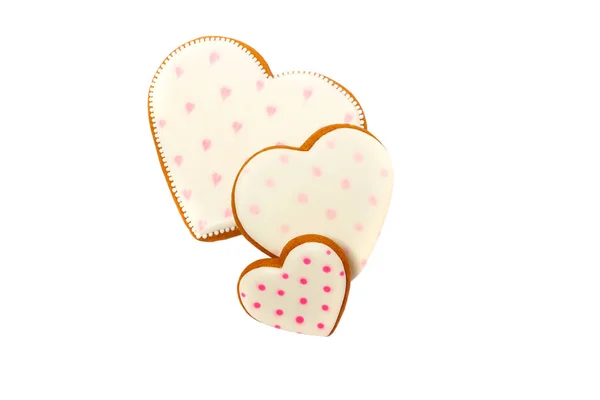 Fundo de cookies cor-de-rosa em forma de coração com diferentes padrões, isolado em branco — Fotografia de Stock