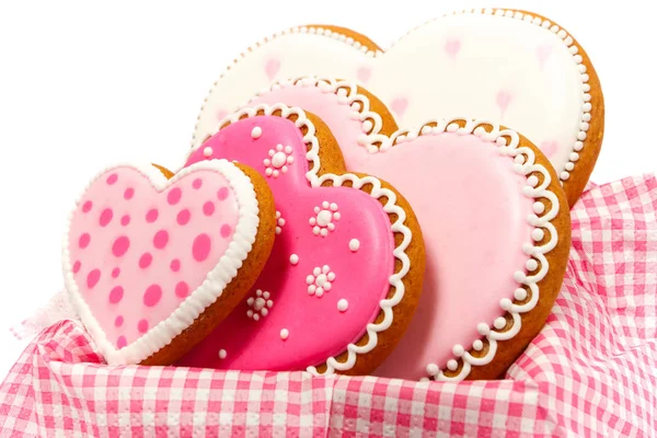 Set di biscotti a forma di cuore rosa con motivi, fatti a mano, sfondo chiaro — Foto Stock