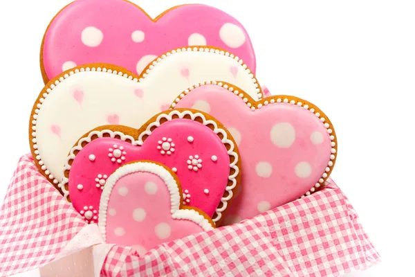 Ensemble de biscuits roses en forme de coeur avec motifs, faits à la main, fond clair — Photo