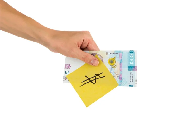 Тисячі гривень і наклейка з різними фінансовими знаками і символами в руці — стокове фото