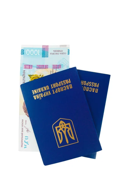 Dos pasaportes ucranianos y mil hryvnias, aislados —  Fotos de Stock