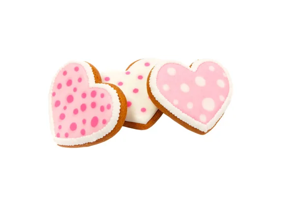 Achtergrond van roze koekjes hartvormig met verschillende patronen, geïsoleerd — Stockfoto
