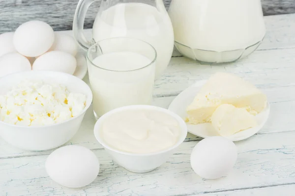 Different Dairy Products White Wooden Boards Blurred Background — Stock Photo, Image