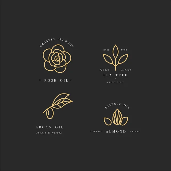 Conjunto vectorial de plantillas de diseño de envases y emblemas en estilo lineal - aceites de belleza y cosméticos - argán, rosa, almendra y árbol de té — Vector de stock