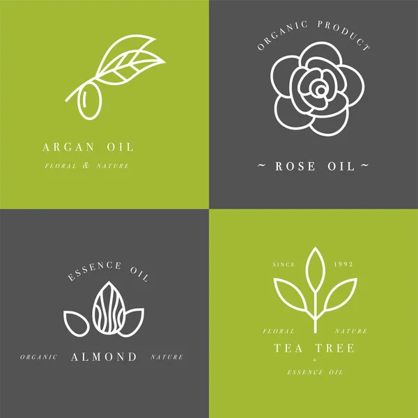 Vector set of packaging design templates and emblems in linear style - beauty and cosmetics oils - argan, rose, almond and tea tree — Stock Illustration Vector set of packaging design templates and emblems in linear style - beauty and cosmetics oils - argan, rose, almond and tea tree Royalty Free Stock Vectors