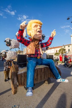 Donald Trump caricature in carnival parade of floats and masks i clipart