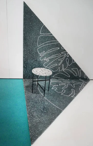 decorated wall and metal stool with fabric