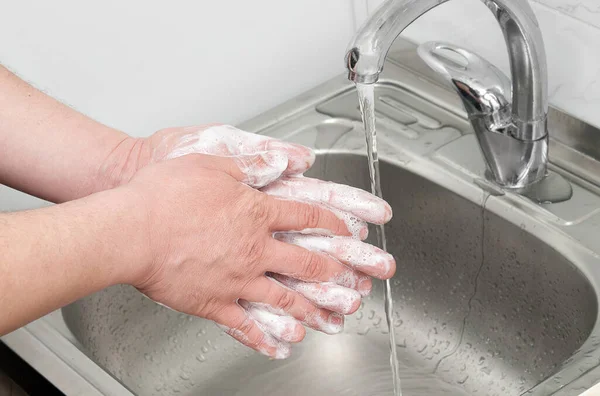 Wash your hands well between your fingers with soap and water under a tap