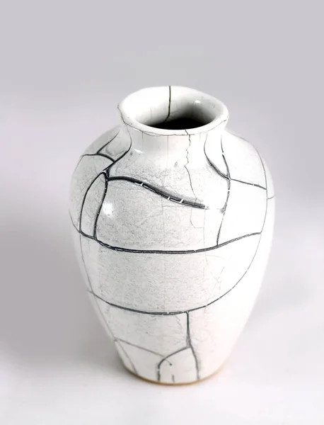 Beautiful Old vase with cracks in studio shot